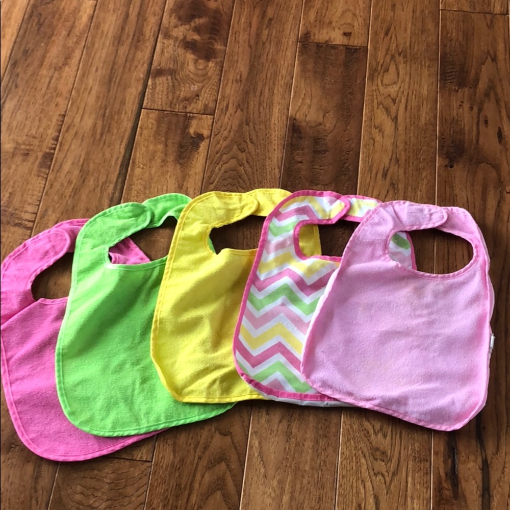 5 bibs with plastic backing